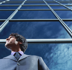 Graphics of modern building and gentleman looking upwards